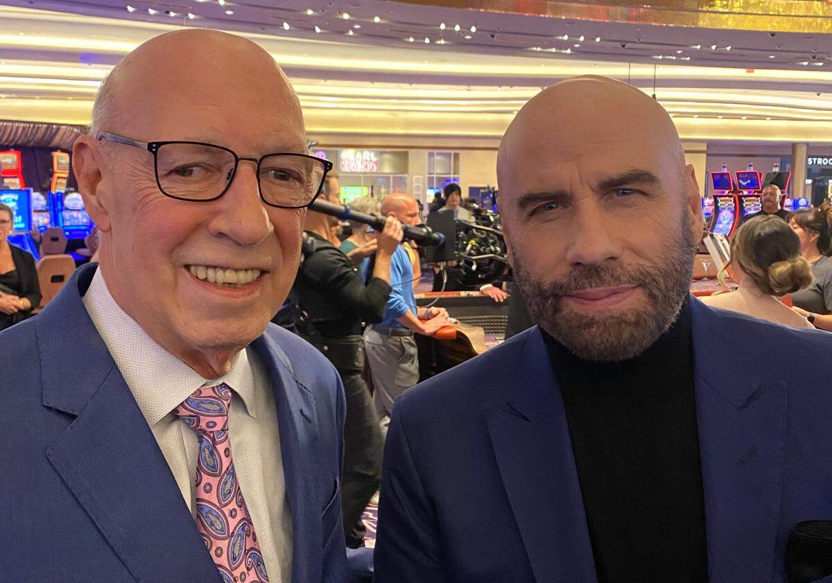 John Travolta, right, and Scarlet Pearl Casino owner Bob Granieri pose for a picture on the casino floor during filming of Travolta’s sequel to “Cash Out” in D’Iberville and other South Mississippi locations in 2023.