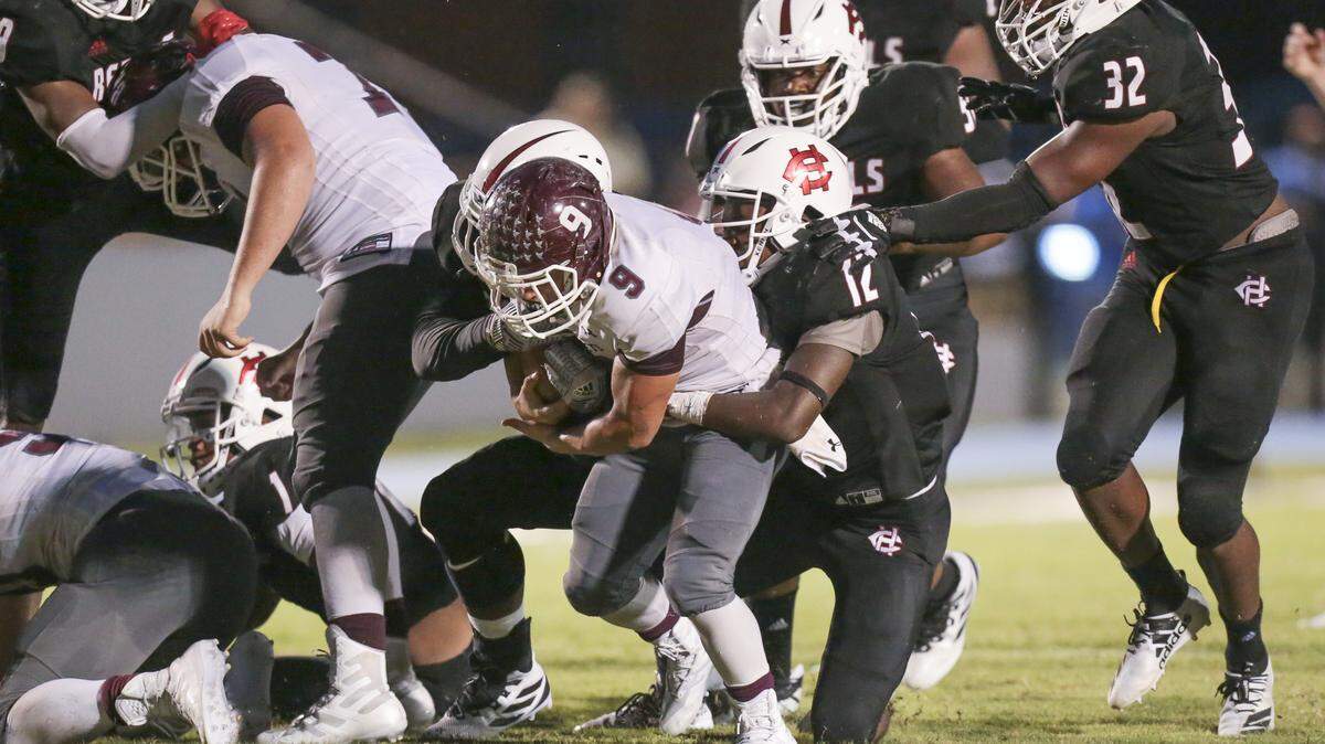East Central running back Dylan Grinsteinner (9) makes a crucial first down in the final minutes of play during the Port City Classic game between East Central and Harrison Central at Milner Stadium, Gulfport on Friday, August 23, 2019.