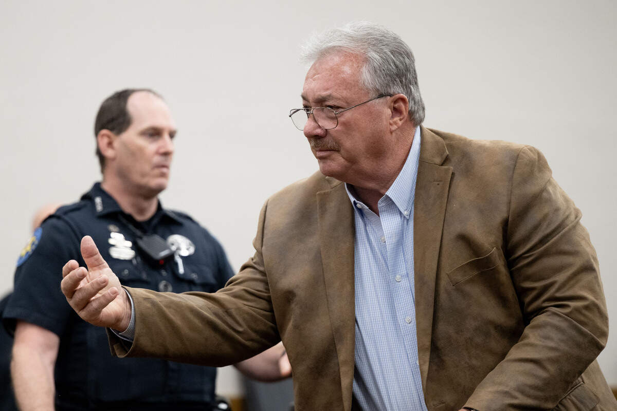 Philip Moran gestures to people in the gallery after having his bond revoked during a hearing at Harrison County Circuit Court in Biloxi on Friday, March 13, 2026.