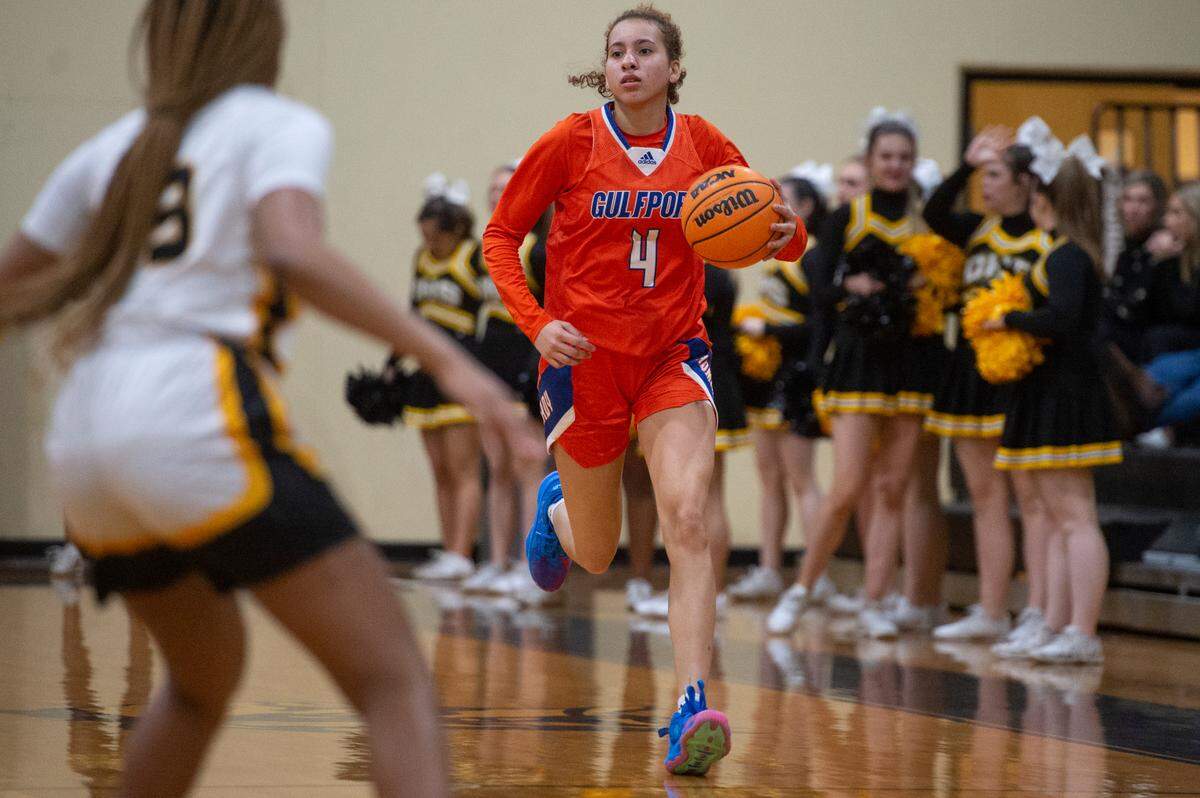 Gulfport’s Micah O’Dell dribbles the ball down the court during a playoff game at D’Iberville High School in D’Iberville on Friday, Feb. 17, 2023.