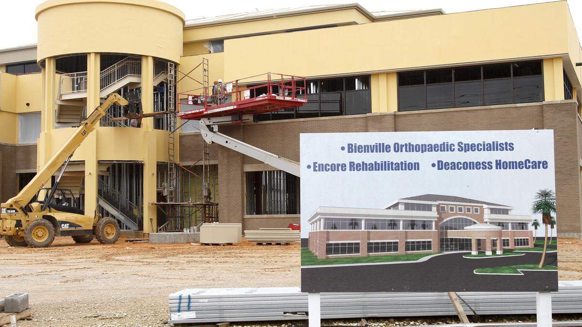 TIM ISBELL/SUN HERALDBienville Orthopaedic Specialists, whose new building, was under construction Friday, hopes to attract patients from state line to state line. The sign at right shows what the finished building will look like.