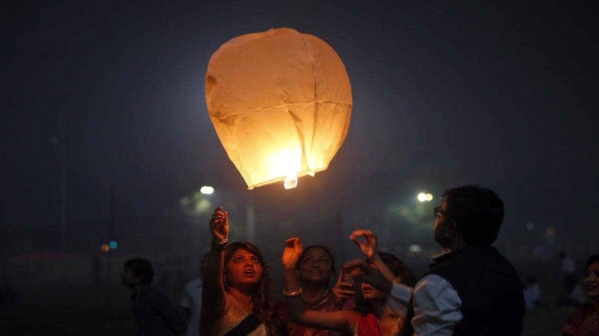 Rajanish Kakade/Associated PressA lantern is released to celebrate Diwali in Mumbai, India, on Nov. 11. Diwali, the festival of lights, is one of Hinduism's most important festivals dedicated to the worship of Lakshmi, the Hindu goddess of wealth.