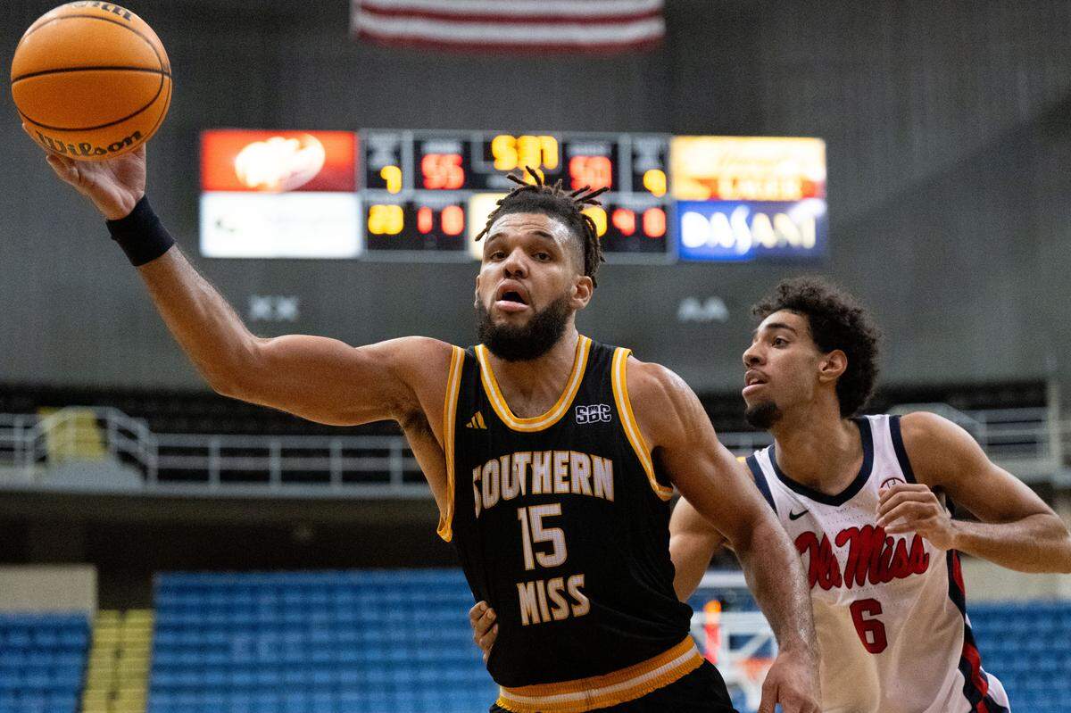 Southern Mississippi forward Djahi Binet (15) catches a pass.