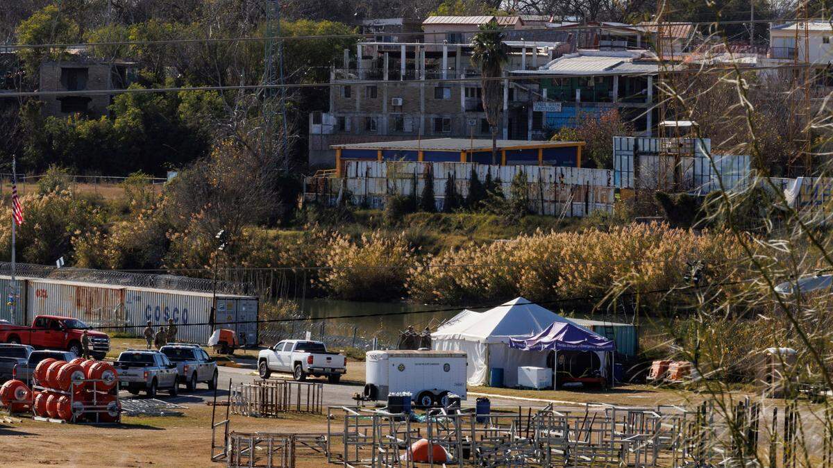 Texas Department of Public Safety officers work inside a fenced off Shelby Park last week in Eagle Pass, Texas. /The San Antonio Express-News via AP)