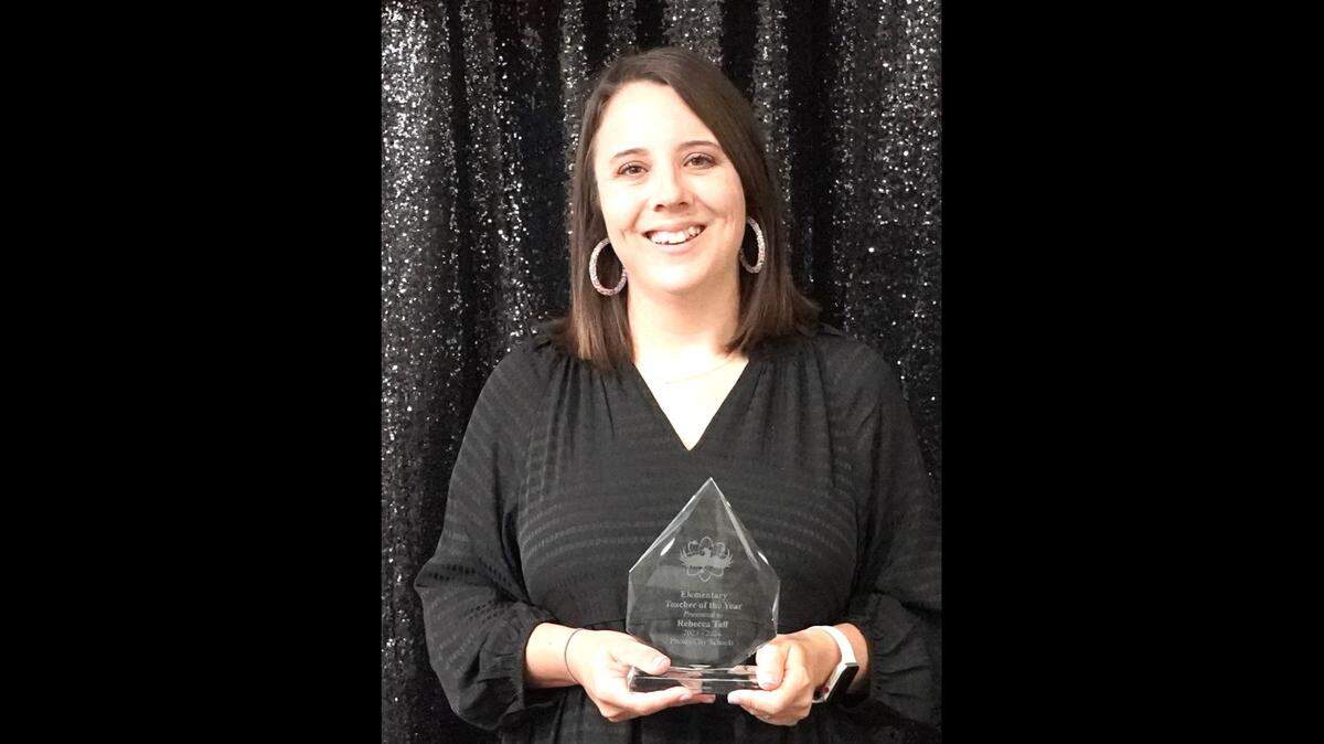 Rebecca Taff, a third-grade teacher at Lakewood, is the Phenix City Schools Elementary Teacher of the Year. She poses with her award at the PCS Night of Stars gala Dec. 7, 2023.