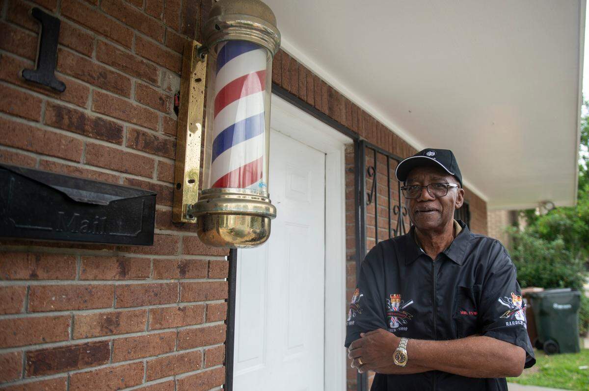 Tyrone Burton, who has been cutting hair in Biloxi for 64 years, stands outside his business, Tyrone’s Barber and Beauty Salon, in Biloxi on Wednesday, May 21, 2025.