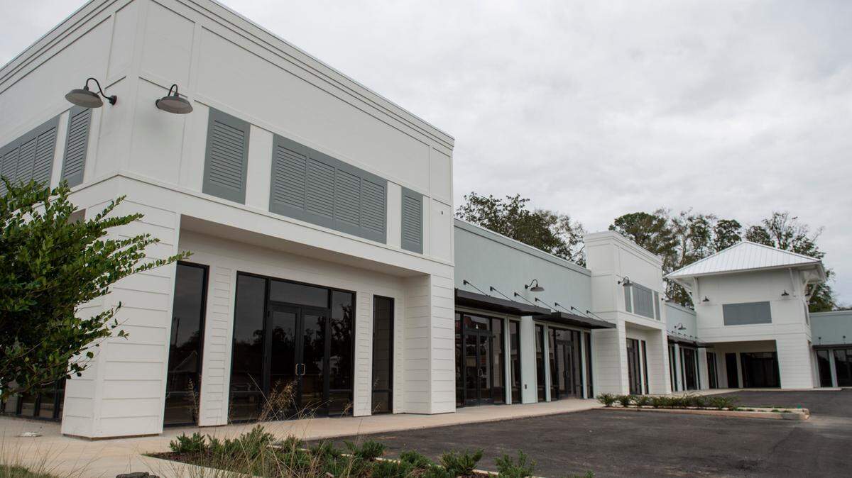 A new shopping plaza on the corner of Cowan Road and Magnolia Street in Gulfport on Wednesday, Jan. 5, 2022. The white facade and frontage on both roads makes it highly visible for the fine wine shop and other tenants locating there.