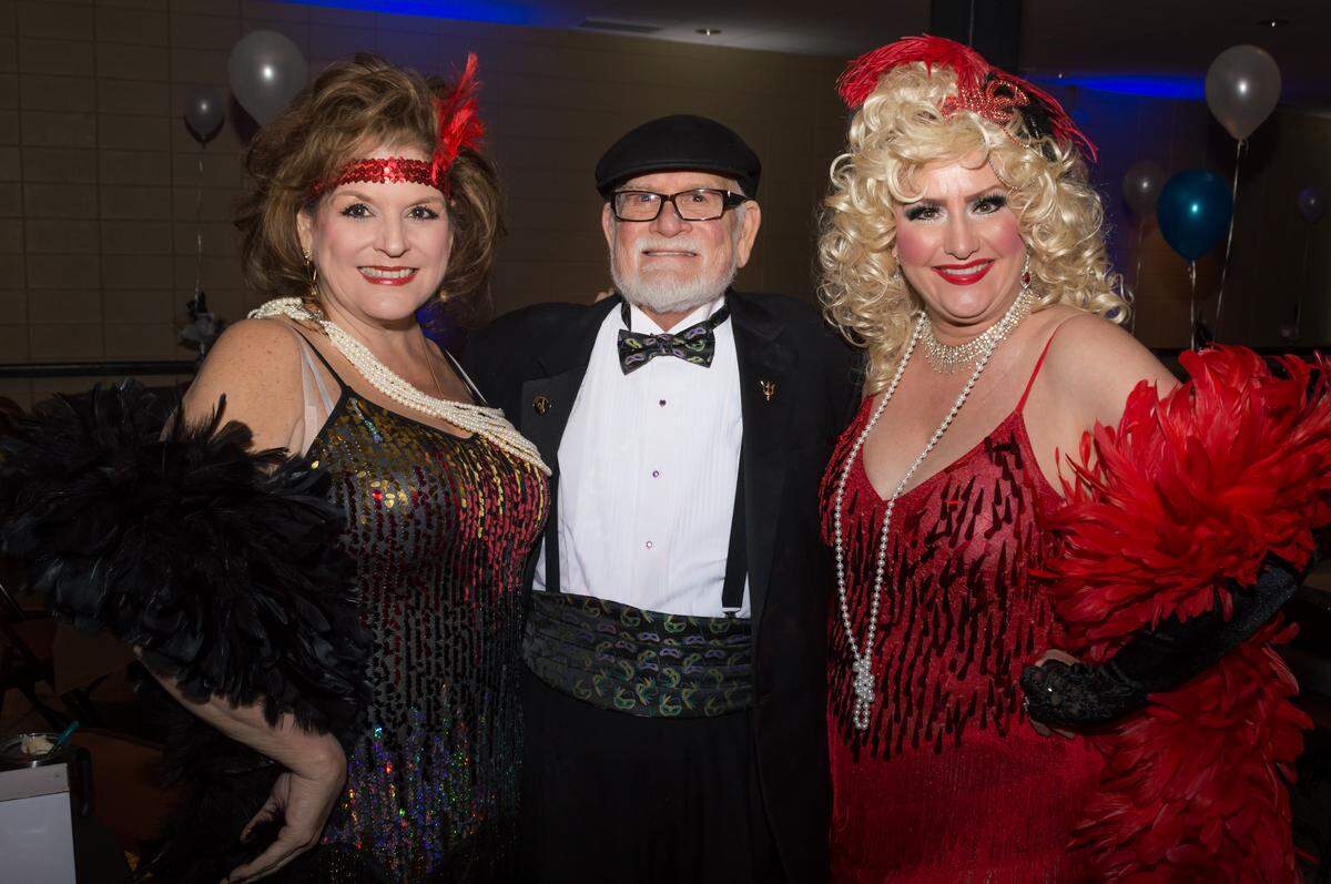 Lisa Glavan (left), her uncle Ed Bossier and Katie Bossier are all dressed up at the Les Badineurs 2020 Mardi Gras ball at the Frank G. Gruich Community Center in Biloxi in this file photo.