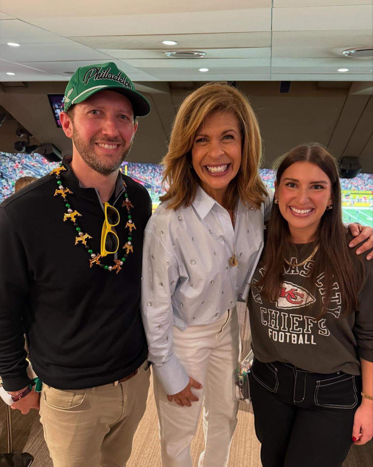 The Spillmans pose for a photo with Hoda Kotb at the Super Bowl.