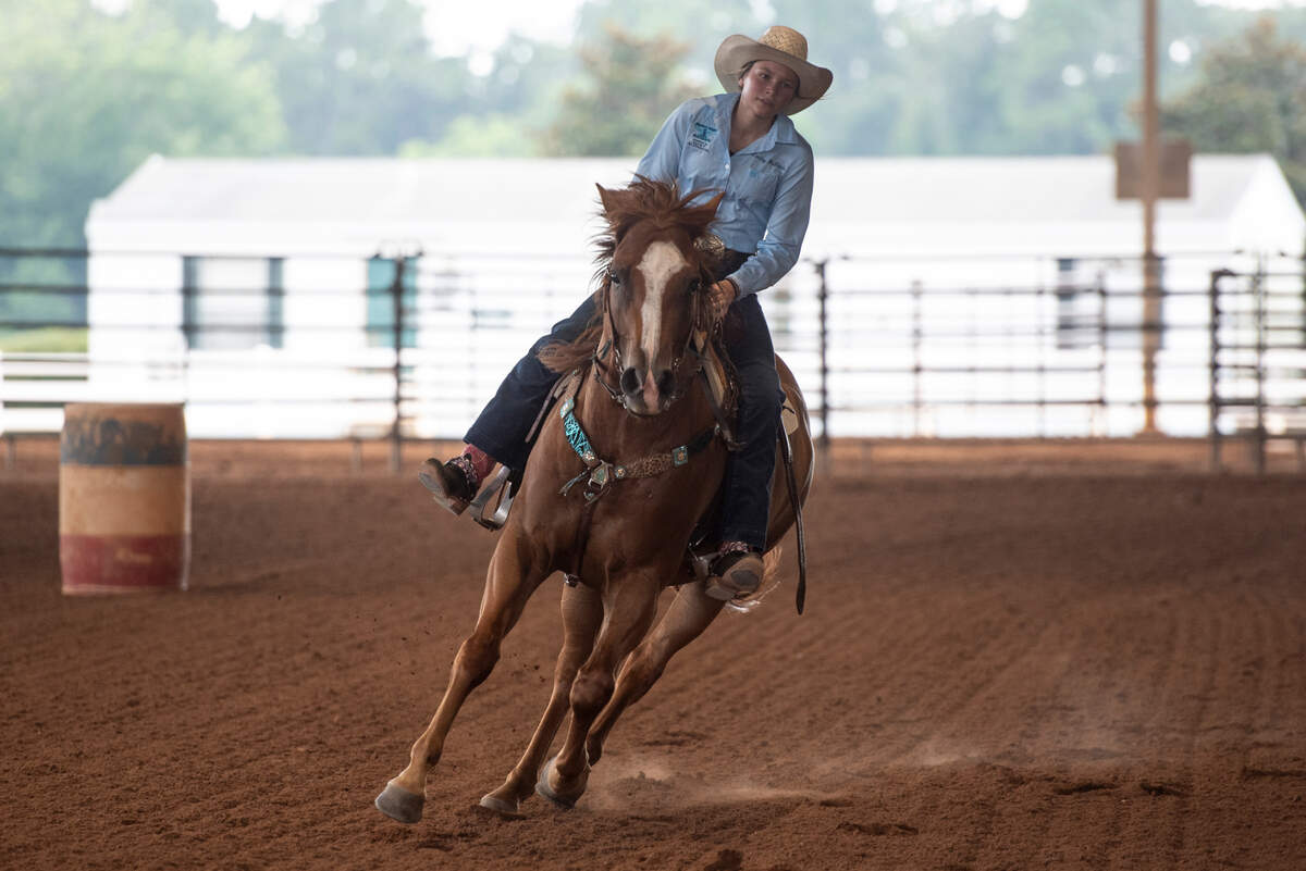 Kinsley McBride practices barrel racing with her horse Jet at the Harrison County Fairgrounds on Thursday, June 13, 2024.