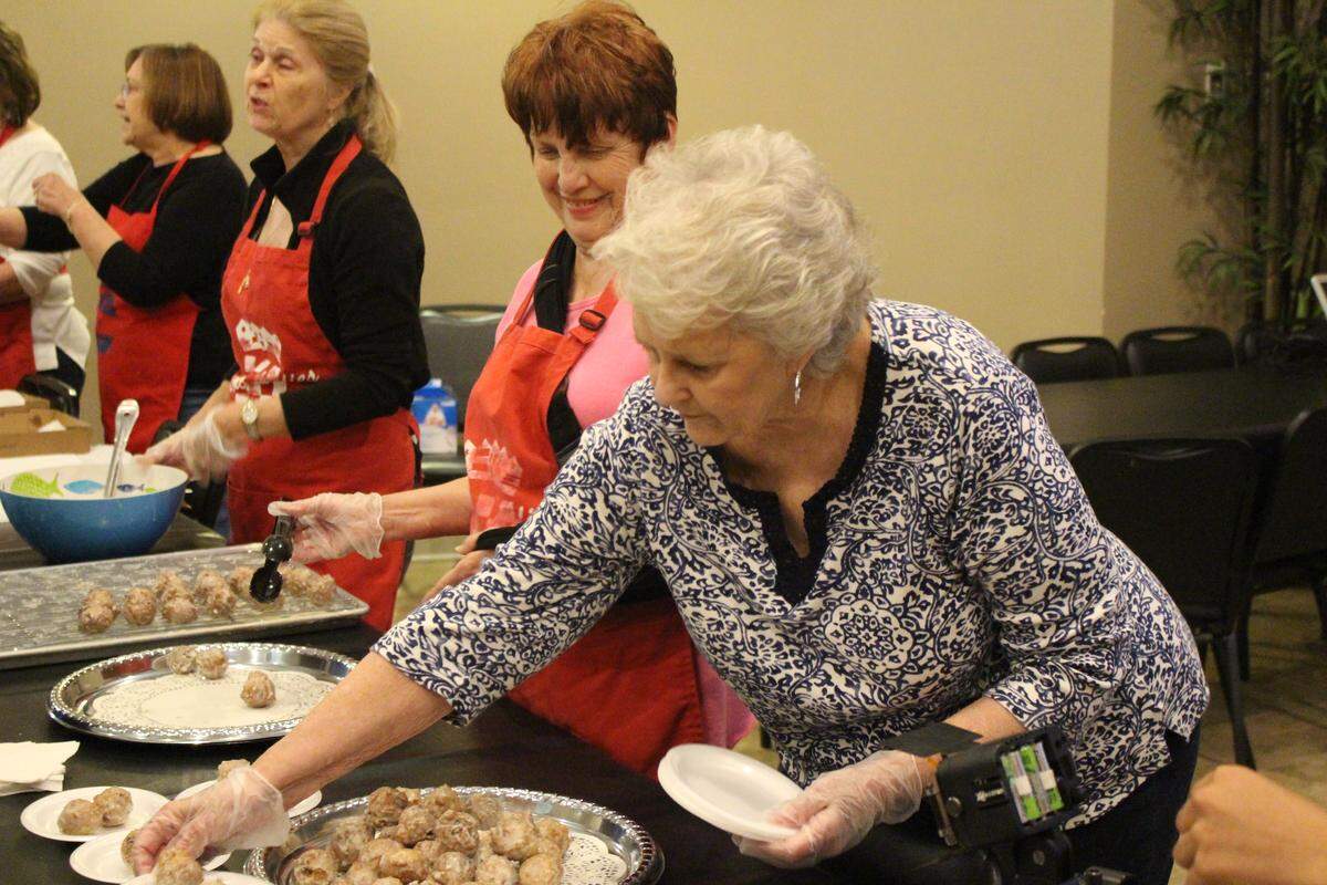 JEFF CLARK/SUN HERALD Patricia Skrnich serves pusharatas at the Slavnoian Lodge in Bilxoi.