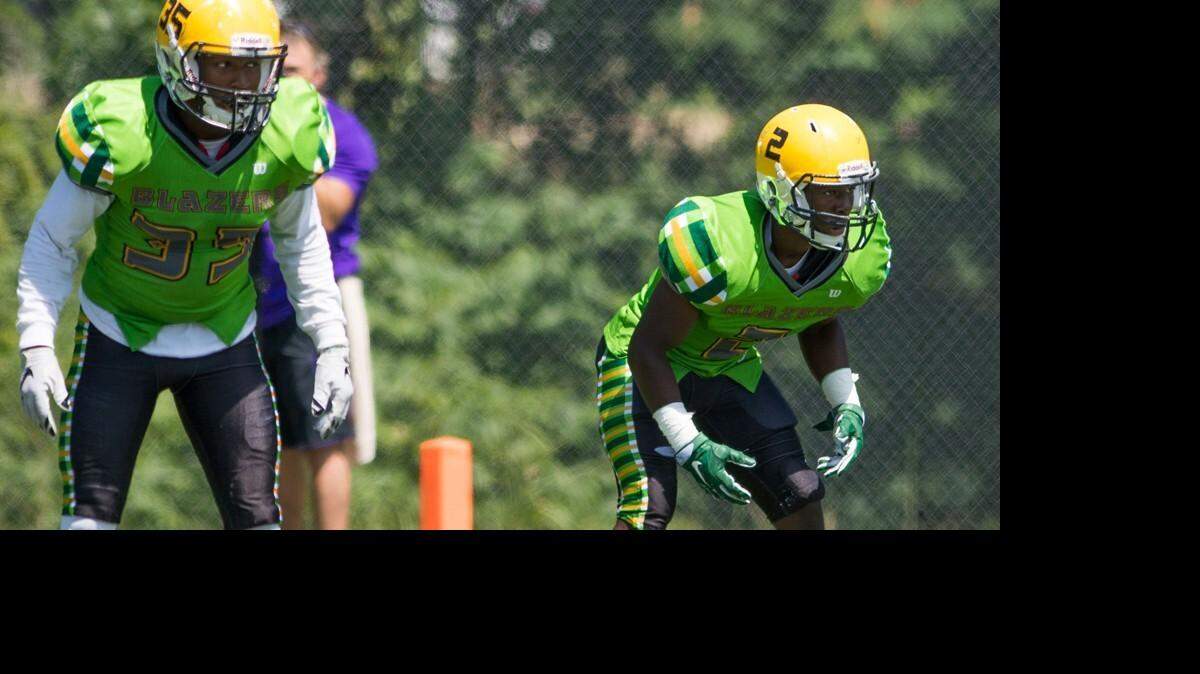 Belhaven's Alvin Vaughn (35) and Isaiah Swopes (2), an Ocean Springs product, both play for Hal Mumme at the Jackson school.