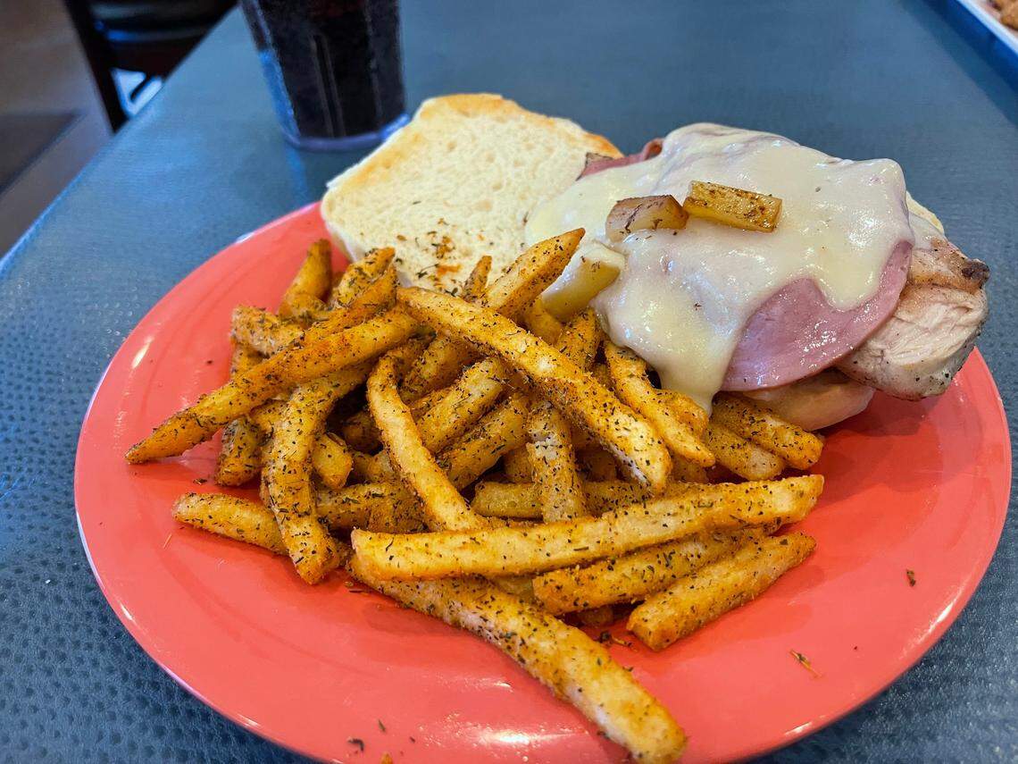 The Malibu sandwich at Harbor View Cafe has chicken, ham, swiss cheese and pineapple. It is served with cajun fries.
