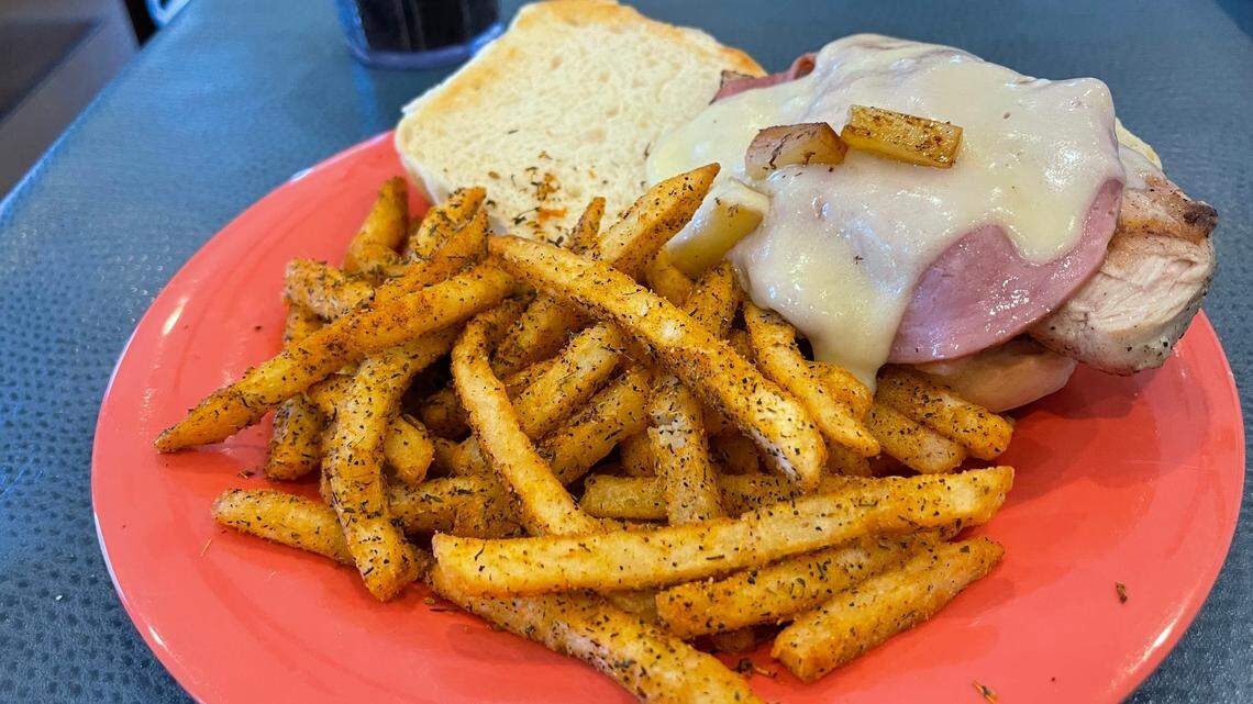 The Malibu sandwich at Harbor View Cafe has chicken, ham, swiss cheese and pineapple. It is served with cajun fries.
