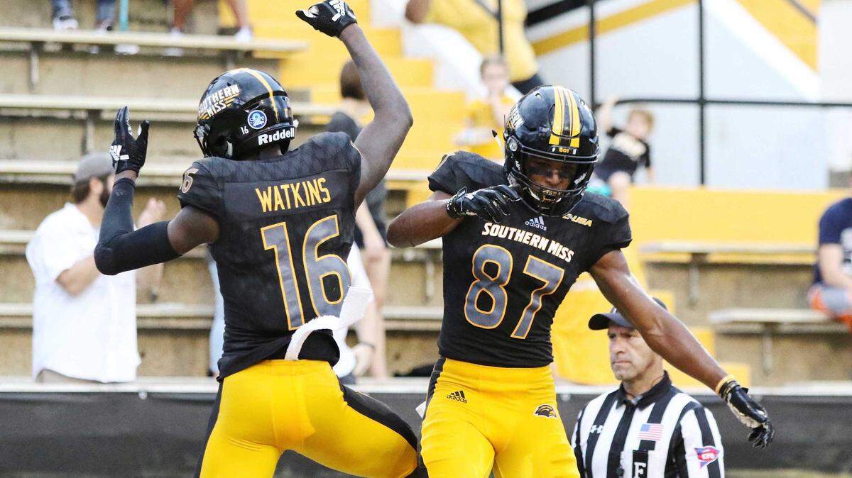 Southern Miss receivers Quez Watkins (16) and Tim Jones (87) celebrate a touchdown by Watkins against Rice Saturday on Sept. 22, 2018, in Hattiesburg.