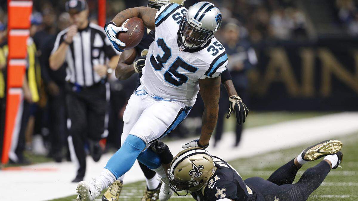 Carolina Panthers fullback Mike Tolbert (35) carries as New Orleans Saints free safety Jairus Byrd (31) tries to tackle in the second half of an NFL football game in New Orleans, Sunday, Dec. 6, 2015. (AP Photo/Jonathan Bachman)