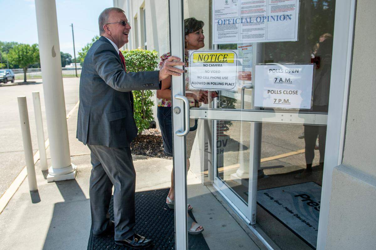 Jackson County Sheriff Mike Ezell, a Republican candidate for Mississippi’s Fourth District Congressional seat, arrives to vote in his runoff election at First Presbyterian Church in Pascagoula with his wife Suzette on Tuesday, June 28, 2022.