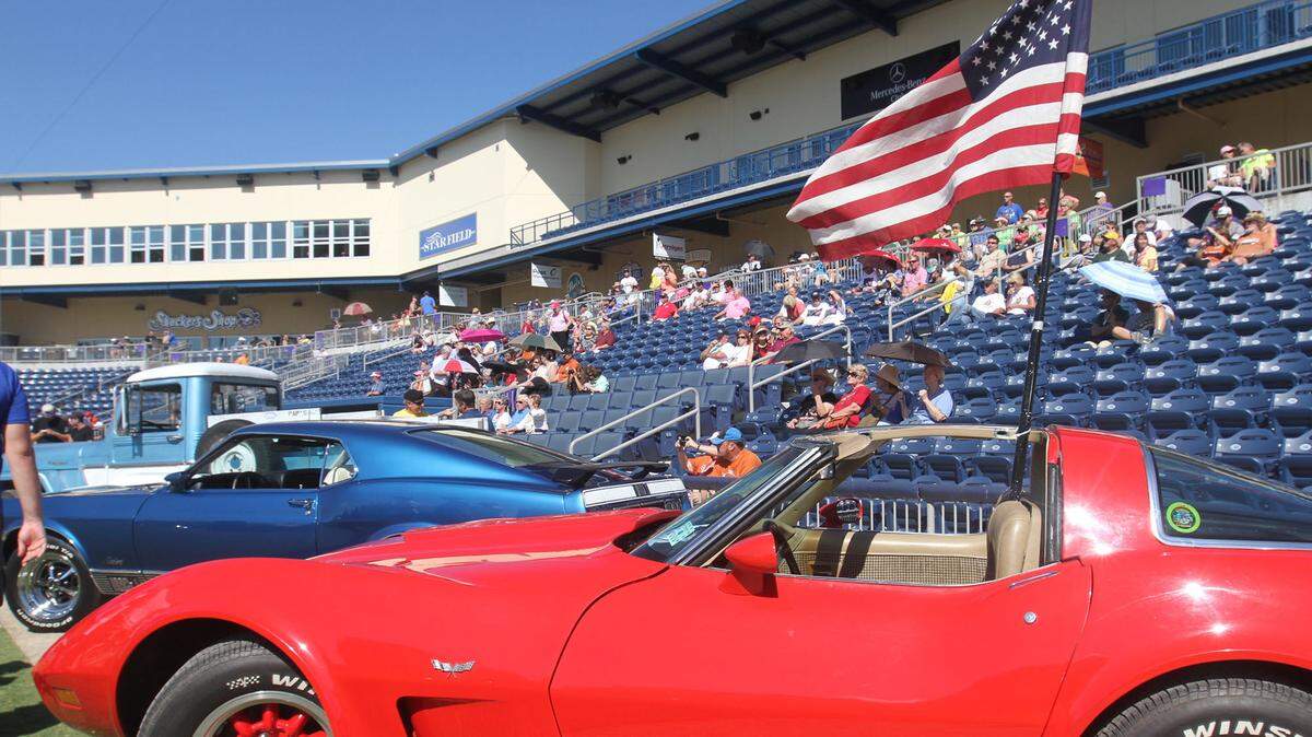 JOHN FITZHUGH/SUN HERALD 
 A flag flies from a 1979 Chevrolet Corvette owned by David Childress of Pascagoula during the Cruisin' The Coast salute to the military event at MGM Park in Biloxi on Tuesday Oct. 6, 2015.