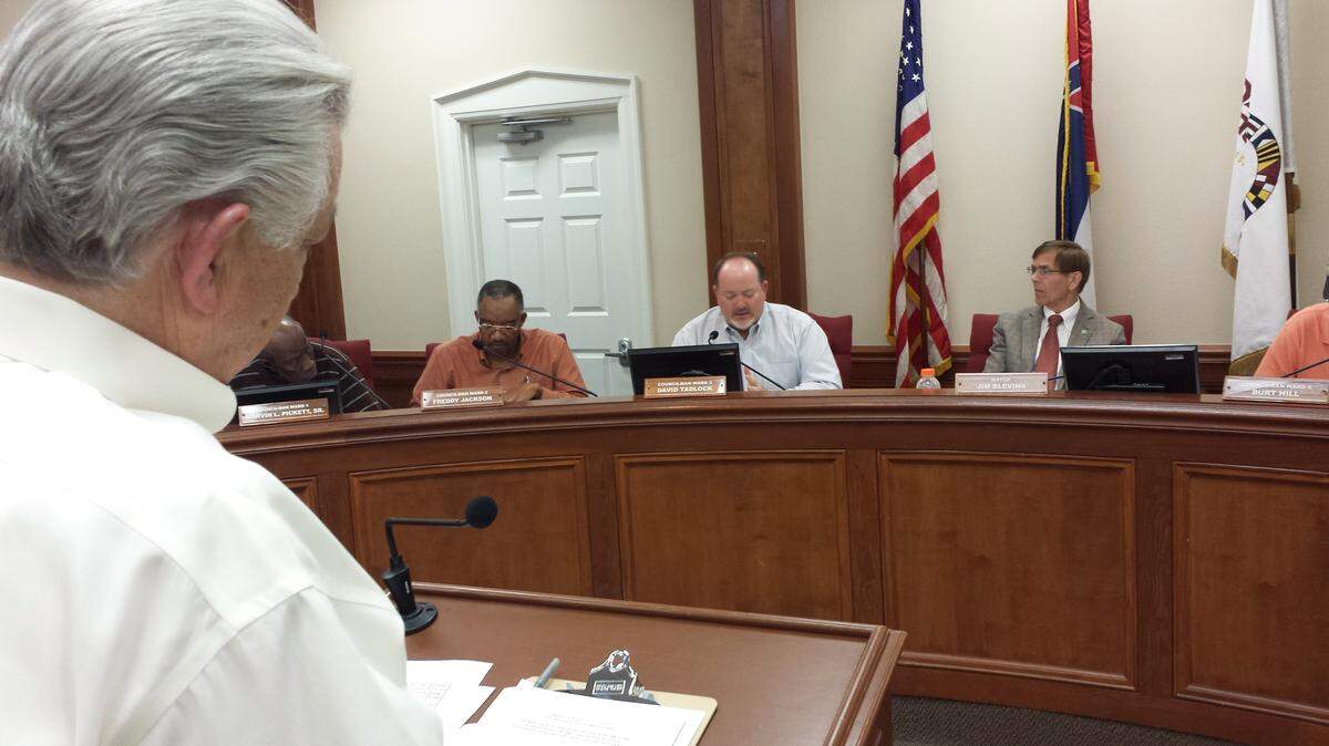 KAREN NELSONPascagoula Comptroller Bobby Parker, left, tells the City Council recently that money coming in from last month's rate increase for city water and sewer may bring in more money than anticipated. Pictured, from left, are councilmen Freddy Jackson and David Tadlock and Mayor Jim Blevins.