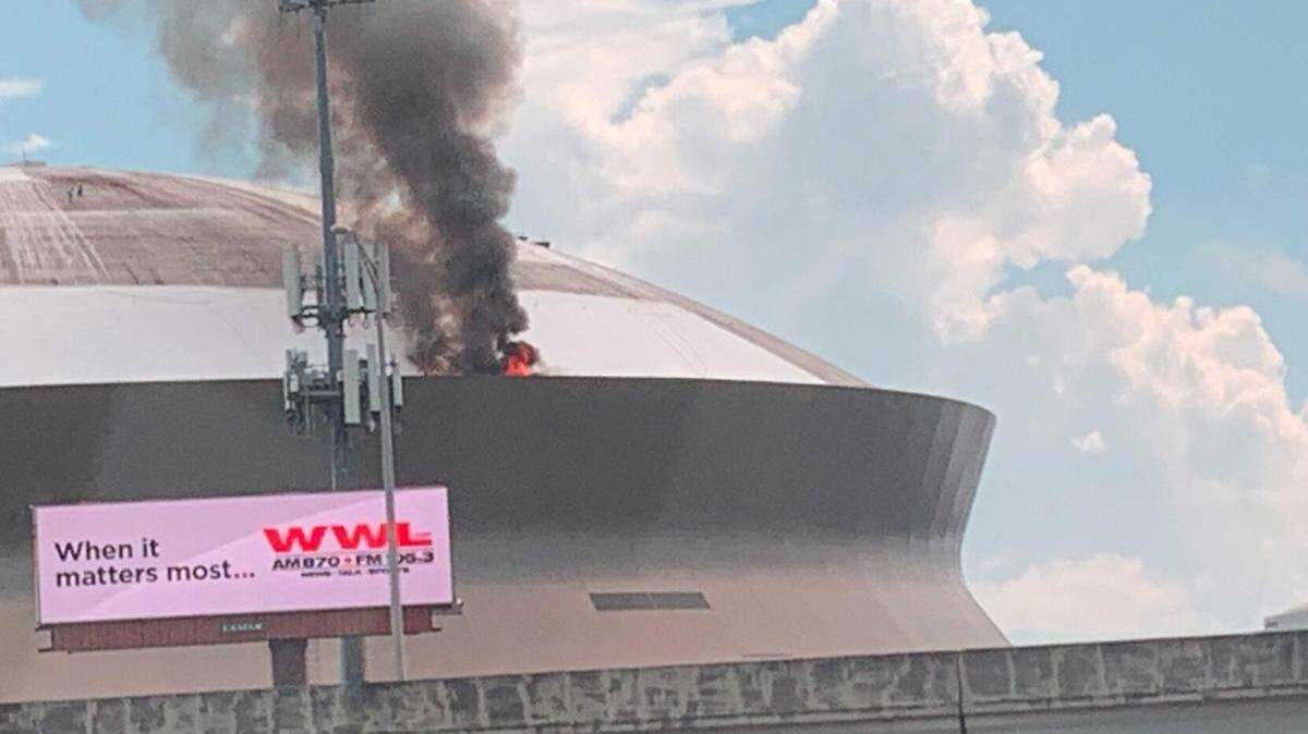 Smoke and flames rise from the roof of the Superdome in New Orleans on Tuesday, Sept. 21, 2021, in this photo provided to Nola.com from city councilmember Joe Giarrusso.
