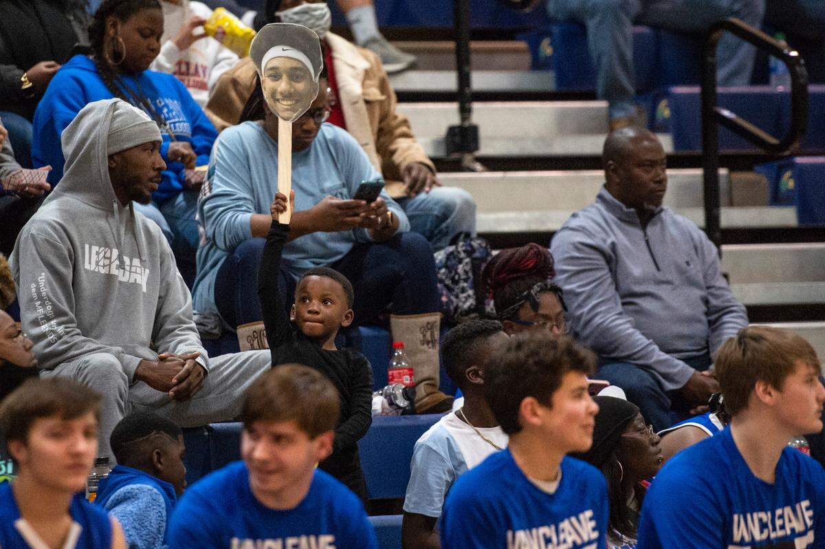 A young fan holds a cutout of Vancleave forward Oscar Hampton’s head during a game against Gautier at Gautier High School in Gautier on Friday, Jan. 21, 2022.
