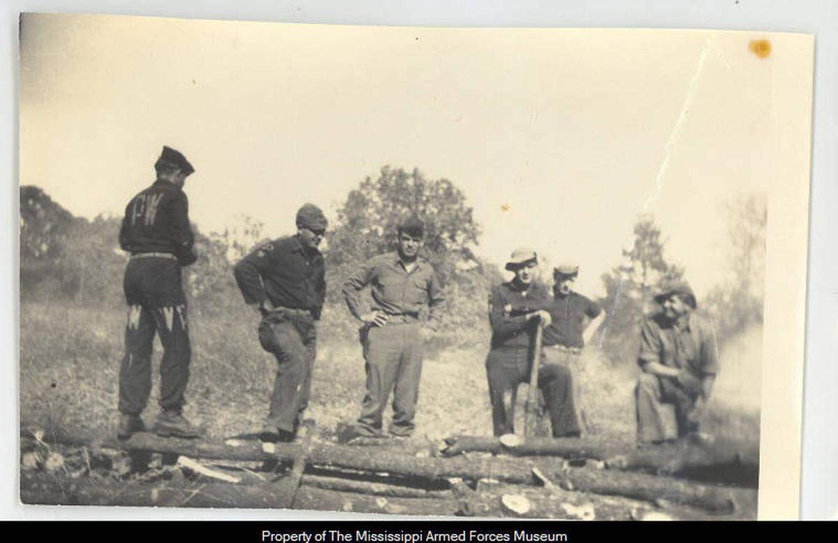 Axis prisoners on or near the coast worked mainly in the lumber industry, harvesting lumber and planting new trees. The P.W. marked on their clothing denotes their status as prisoners of war.