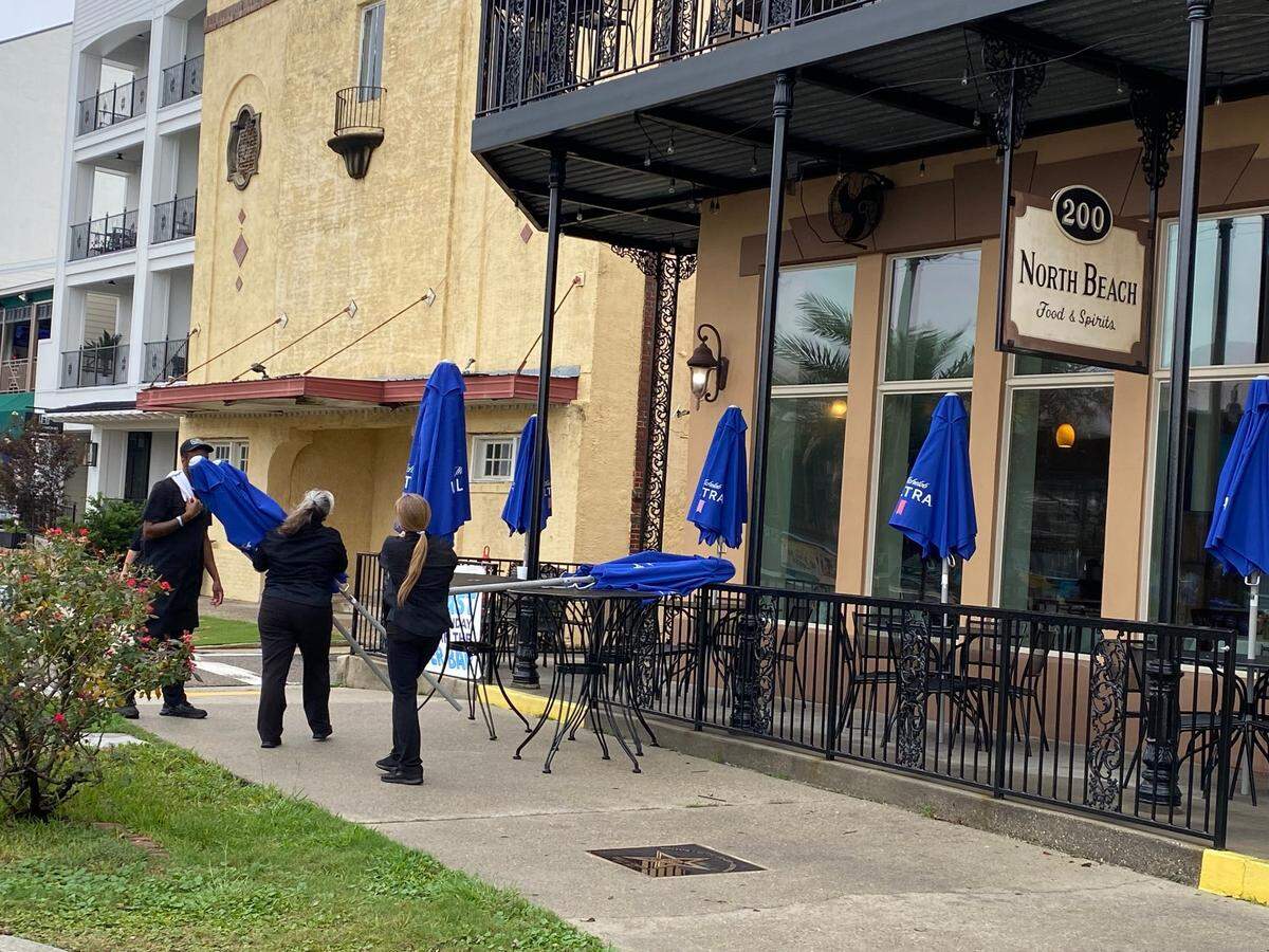 Workers at North Beach in the Bay are removing outdoor tables and umbrella at the restaurant near the marina. The employees said they are doing it in preparation for the higher wind and potential tornado predicted in Hancock County during Francine.