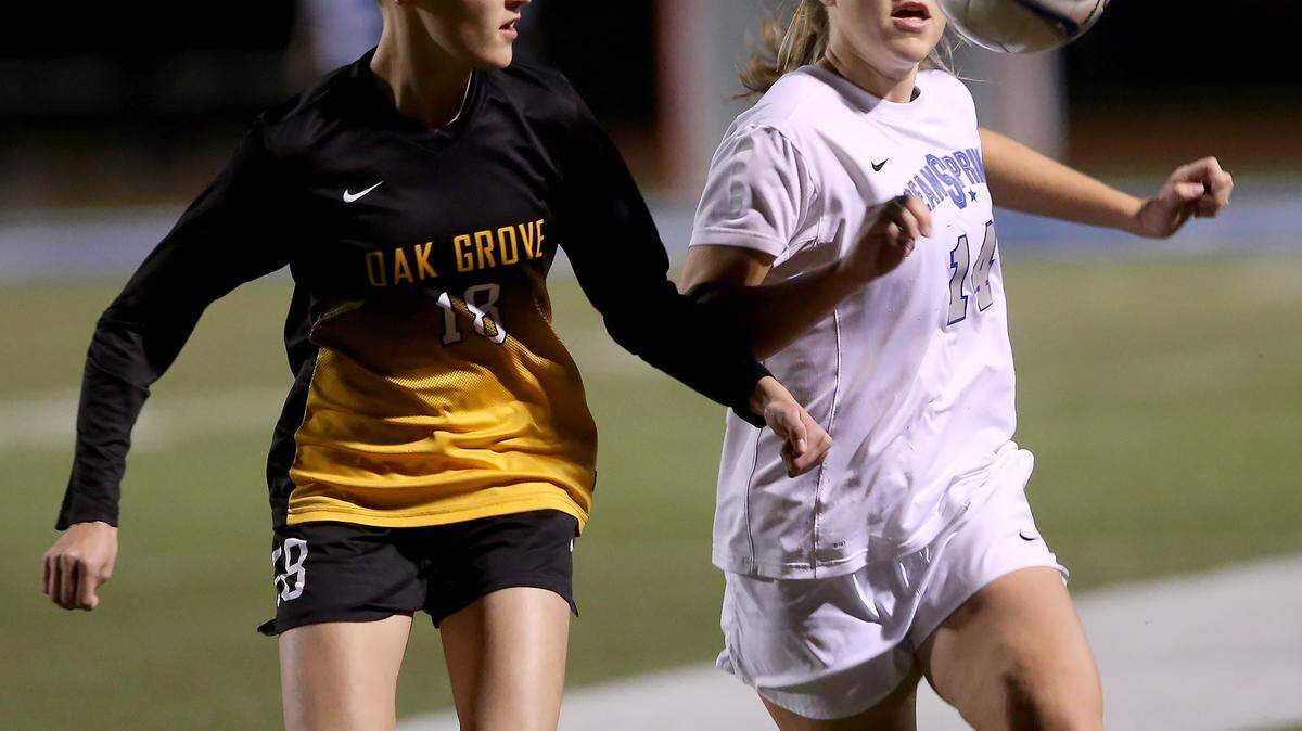 AMANDA McCOY/SUN HERALD 
 Oak Grove's Minali Patton, left, and Ocean Springs' Kaylee Foster compete for the ball during the first round of the Class 6A state playoffs on Monday, January 25 2016.