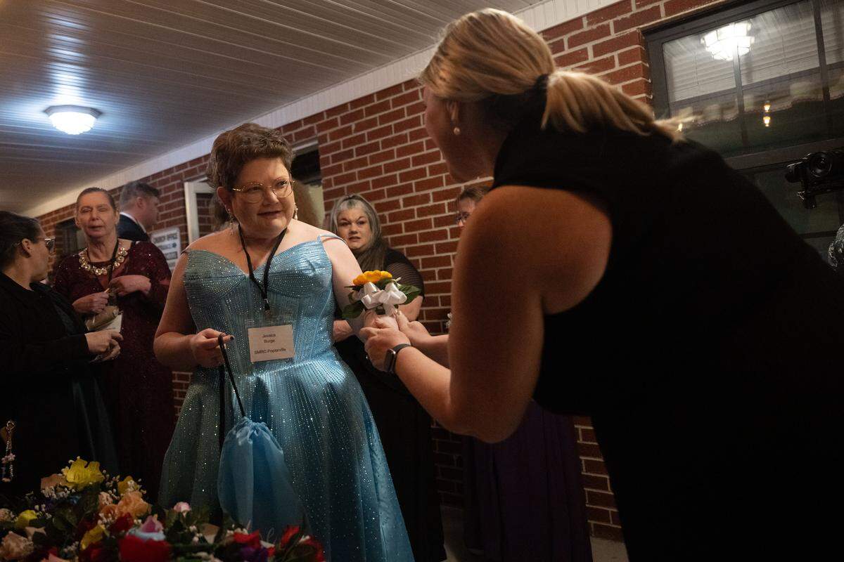 Jessica Burge is given a corsage during Night to Shine at Woolmarket Baptist Church on Friday, Feb. 13, 2026.