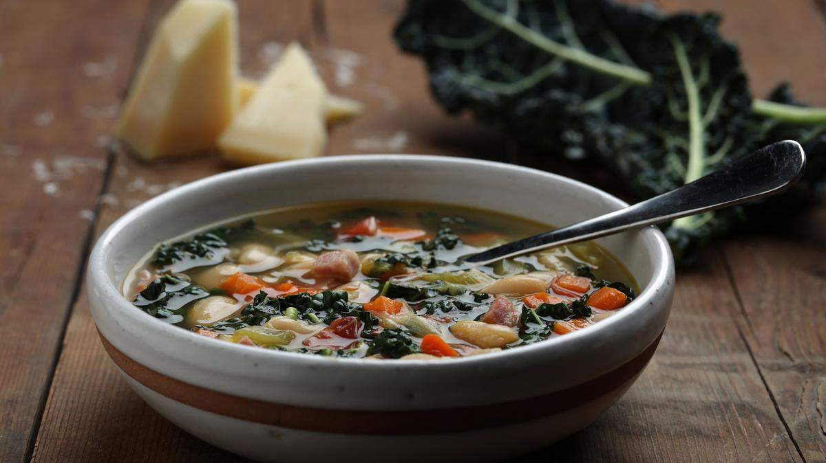 E. JASON WAMBSGANS/CHICAGO TRIBUNE/TNSA long-simmering winter bean soup is packed with vegetables: Leeks, carrots, celery, tomatoes and kale.