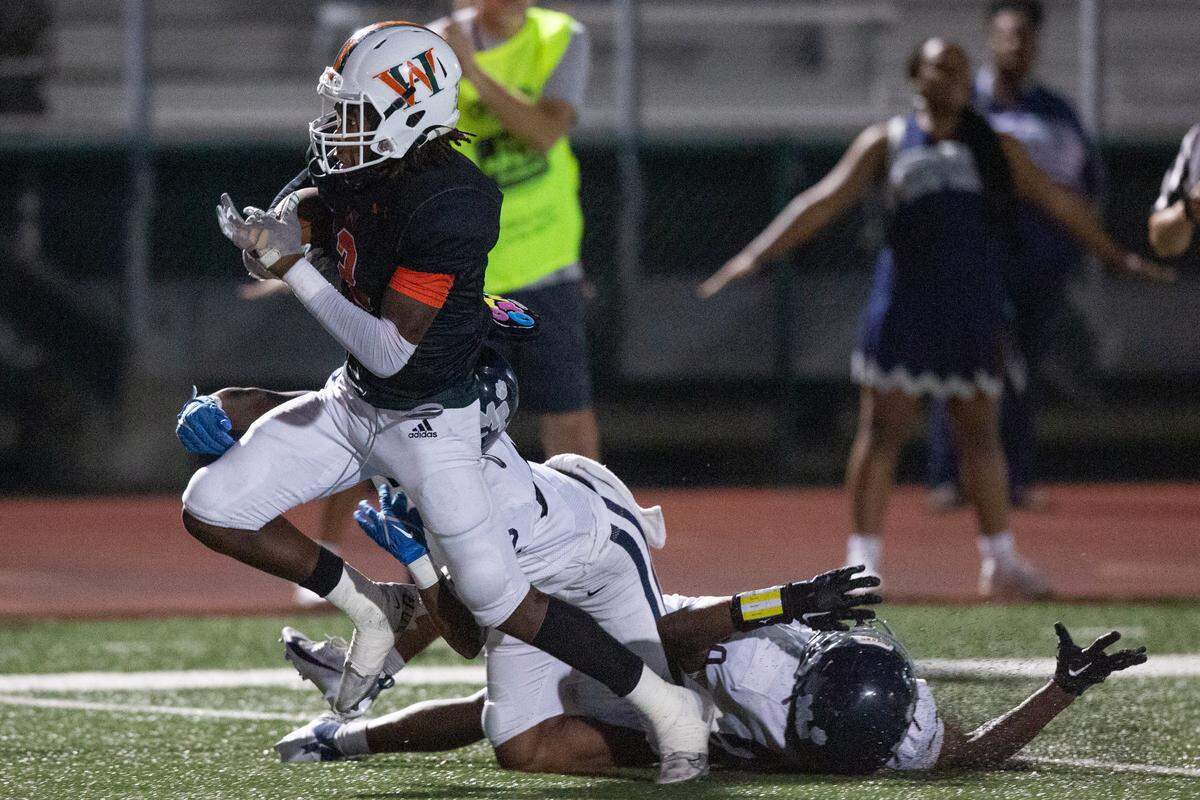West Harrison Hurricanes’ Tyson Johnson avoids the defense during a game against Moss Point at West Harrison High School in Gulfport on Friday, Sept. 22, 2023.