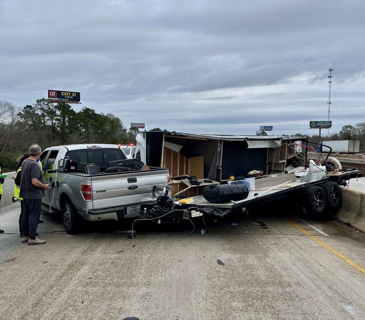 Westbound Interstate 10 closed Friday afternoon near Exit 28 after a car pulling a camper jackknifed. Authorities said at least one person trapped inside the camper was rescued and occupants reported minor injuries.