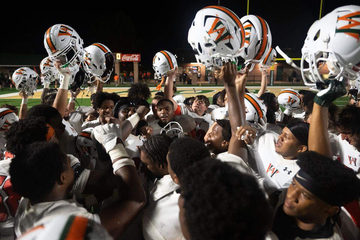West Harrison players celebrate their season-opening victory Friday over Poplarville.