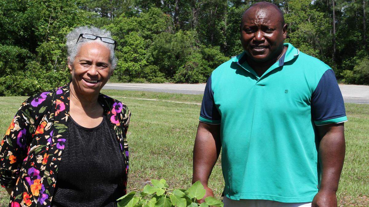 ANITA LEE/SUN HERALD 
 Ruth Story and Master Gardener James L. Franklin are excited about a community garden on 34th Street in Gulfport. The city, which owns the land, has partnered with Story's nonprofit, EEECHO, to oversee the garden. Hopes are it will grown to include a farmer's market.