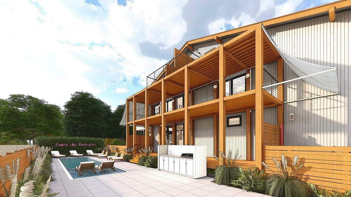 A rendering shows the transformation of a century-old hardware store into Farragut Lofts luxury development in downtown Bay St. Louis.