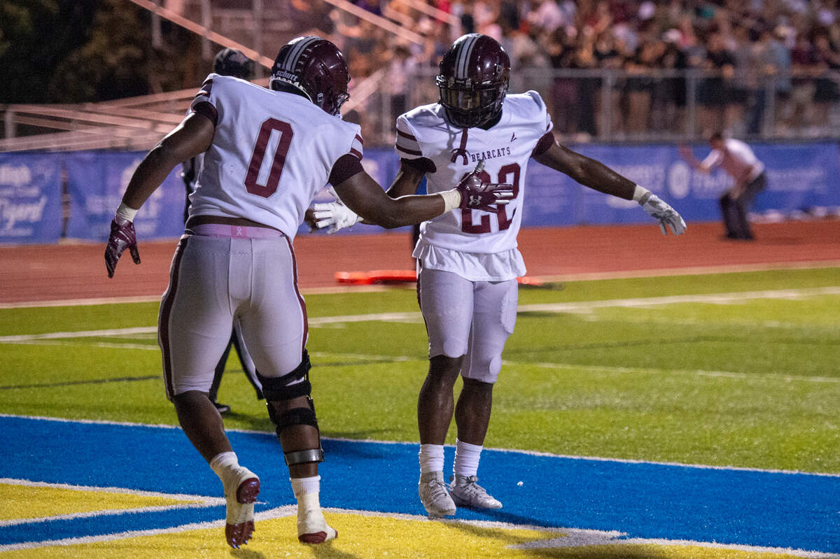 Long Beach’s Taj Aubert and Junior Brown celebrate after a touchdown during a game between Bay High and Long Beach at Tiger Stadium in Bay St. Louis on Friday, Sept. 13, 2024.