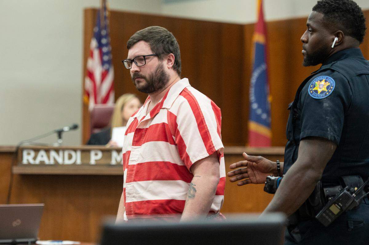 John Ross McElhenney is led out of the court room after being sentenced to life in prison after he plead guilty to sexual battery and child exploitation in Harrison County Circuit Court in Biloxi on Tuesday, Aug. 1, 2023.