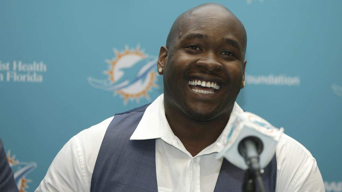 LYNNE SLADKY/ASSOCIATED PRESS 
 In this April 29, 2016, file photo, top Miami Dolphins draft pick Laremy Tunsil smiles during a news conference, in Davie, Fla. Tunsil and the Dolphins were quick to agree on his value in the wake of his NFL draft freefall. The offensive lineman from Ole Miss signed his rookie contract before joining the Dolphins' rookie minicamp which began Friday, May 6.