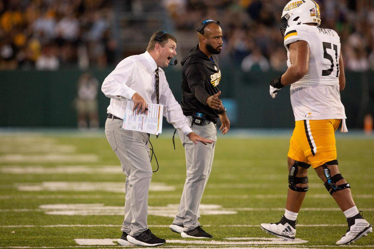 Southern Miss Coach Will Hall talks to his players during a game against Tulane at Yulman Stadium in New Orleans on Saturday, Sept. 24, 2022.