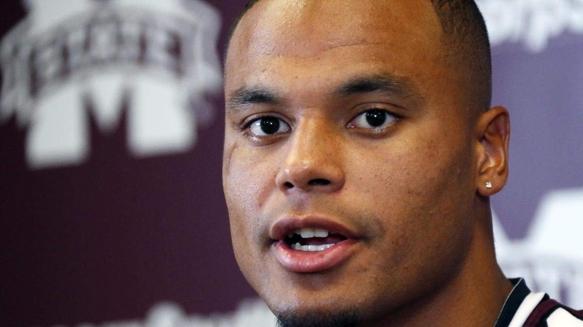Mississippi State quarterback Dak Prescott discusses some of the offensive weapons on his team with reporters during media day, Friday, Aug. 7, 2015 in Starkville, Miss. (AP Photo/Rogelio V. Solis)