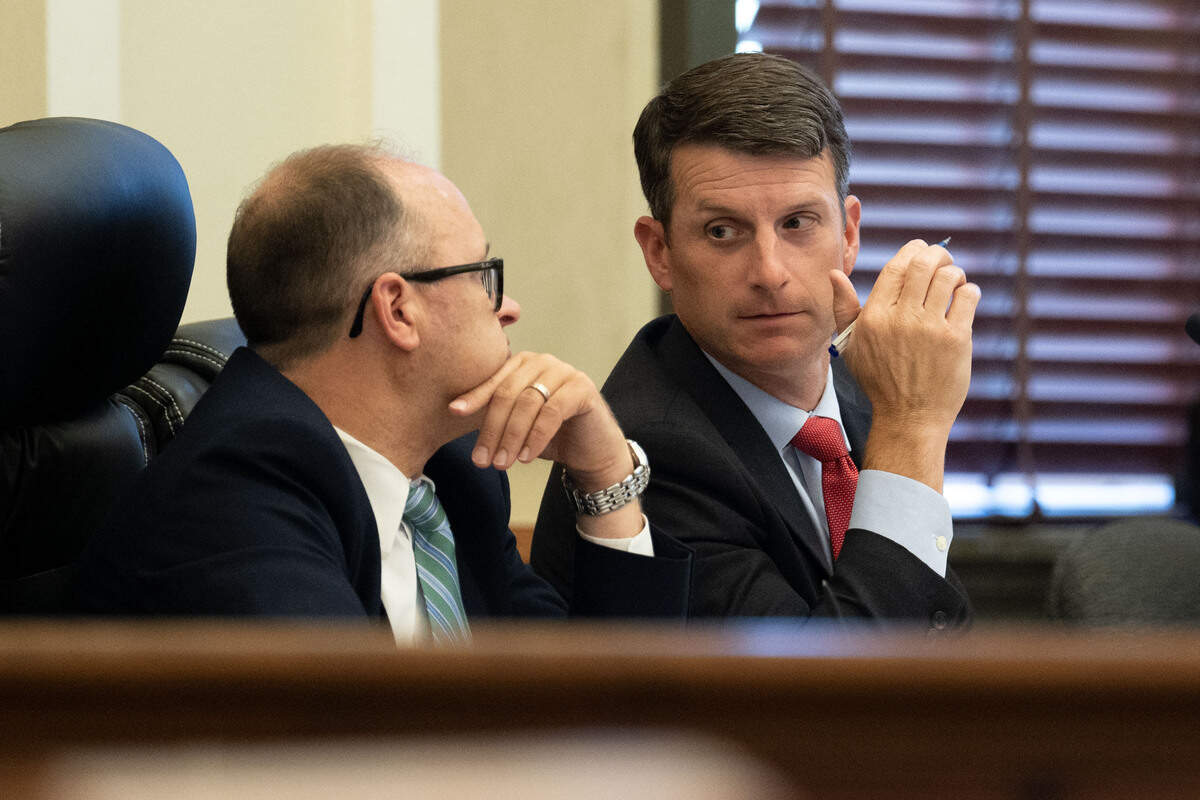 Assistant District Attorneys Matthew Burrell, right, and Chris Daniel, left, speak to each other during a trial for Philip and Alan Moran at Hancock County Circuit Court on Friday, June 12, 2026.