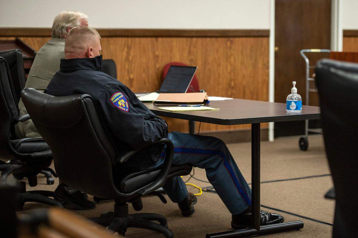 Mississippi state trooper Dale Decamp leans back in his chair during a preliminary hearing at Harrison County Circuit Court in Gulfport on Thursday, Feb. 17, 2022. Decamp is potentially facing a misdemeanor assault charge.