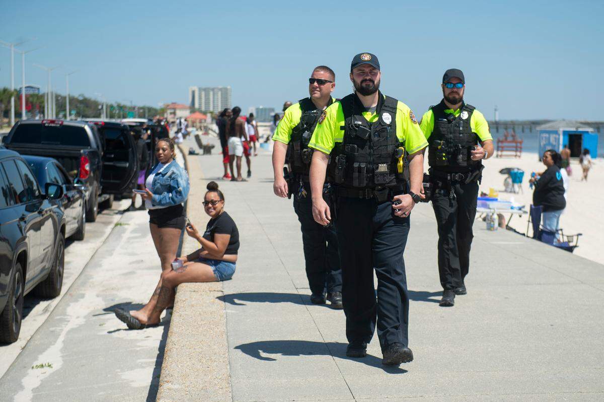 Biloxi police officers patrol a stretch of Biloxi Beach during Black Spring Break on Saturday, April 12, 2025.