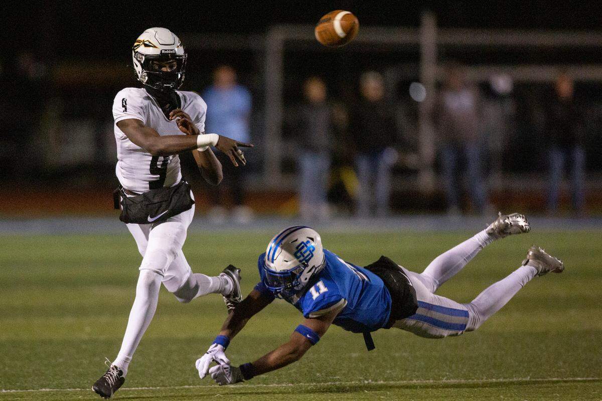 Oak Grove quarterback Aj Maddox throws a pass during a 6A playoff game at Greyhound Stadium in Ocean Springs on Friday, Nov. 18, 2022.