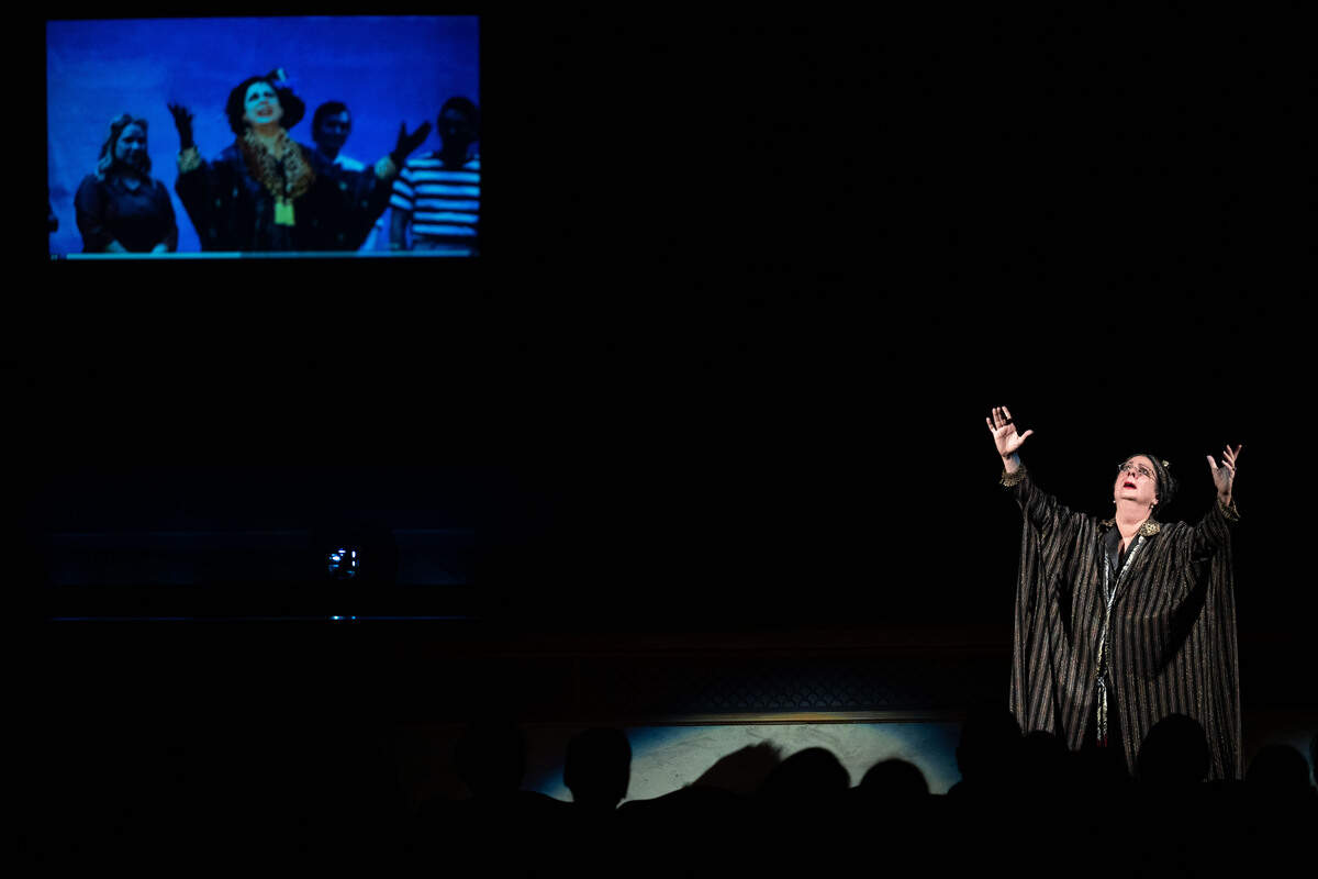 Terese Evans reenacts a recording of an opera song during a grand opening celebration at the Saenger Theatre in Biloxi on Saturday, June 6, 2026.
