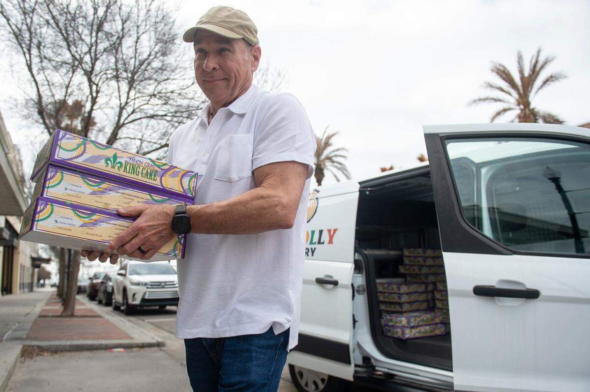 Restaurateur Robert St. John unloads Loblolly Bakery king cakes from a truck for a Gulfport pop-up for the bakery on Friday, Feb. 7, 2025. The pop-up was set up outside The Downtowner, St. John’s future restaurant in downtown Gulfport.