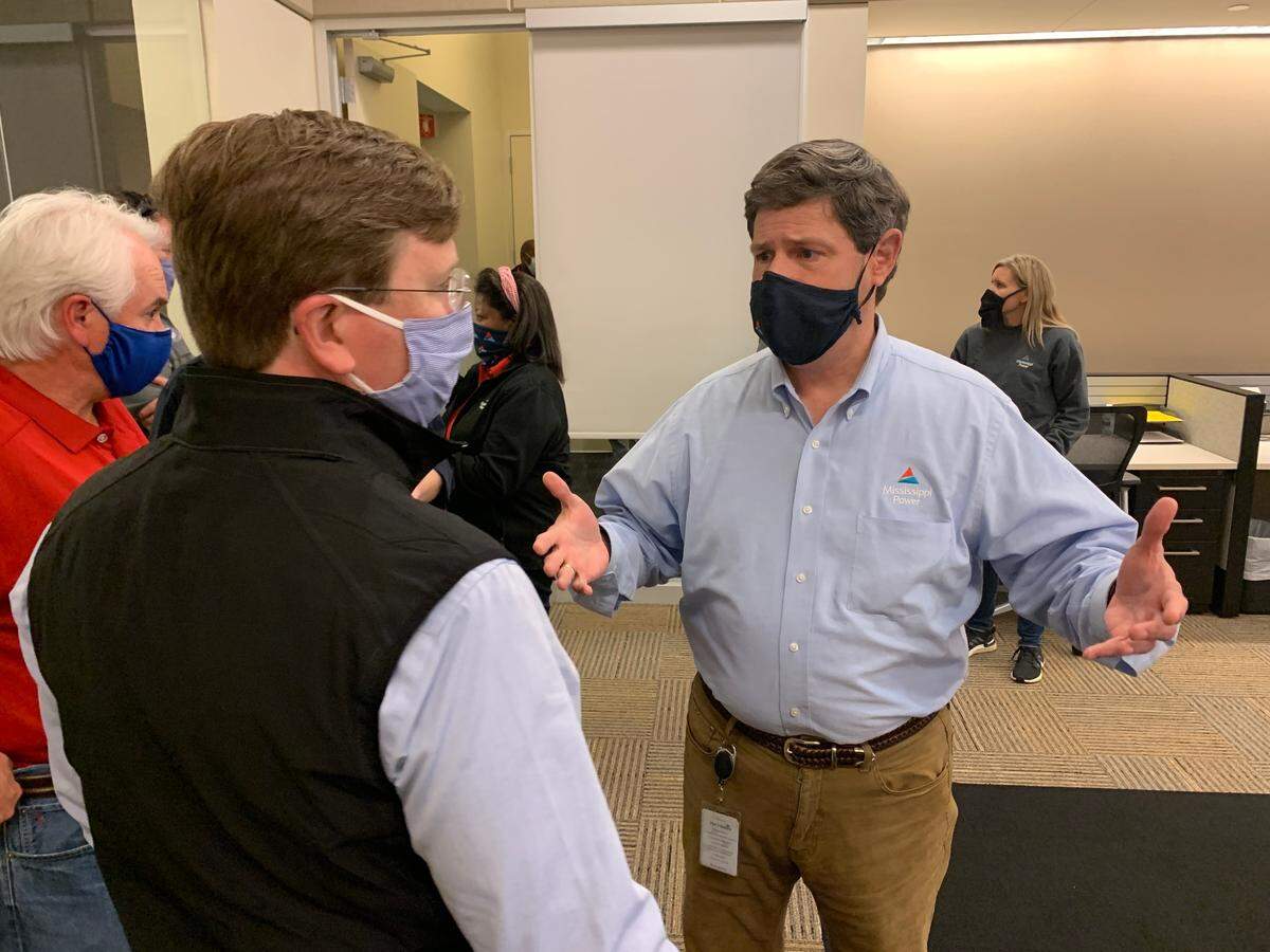 Mississippi Power CEO Anthony Wilson, right, updates Gov. Tate Reeves at the Mississippi Power operations center on Thursday, Oct. 29, a day after Hurricane Zeta knocked out power to hundreds of thousands of homes and businesses in South Mississippi.