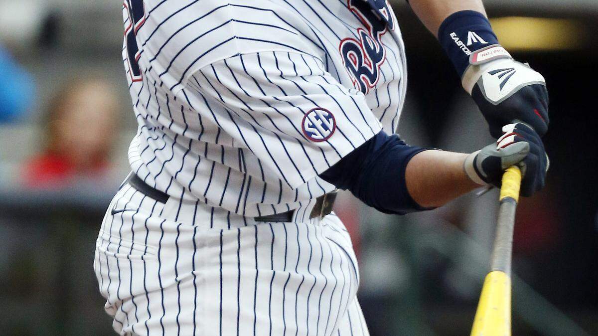 Mississippi infielder Colby Bortles (25) makes contact for a double against Mississippi State during the first inning of the Governor's Cup college baseball game at Trustmark Park in Pearl, Miss., Tuesday, April 28, 2015. (AP Photo/Rogelio V. Solis)