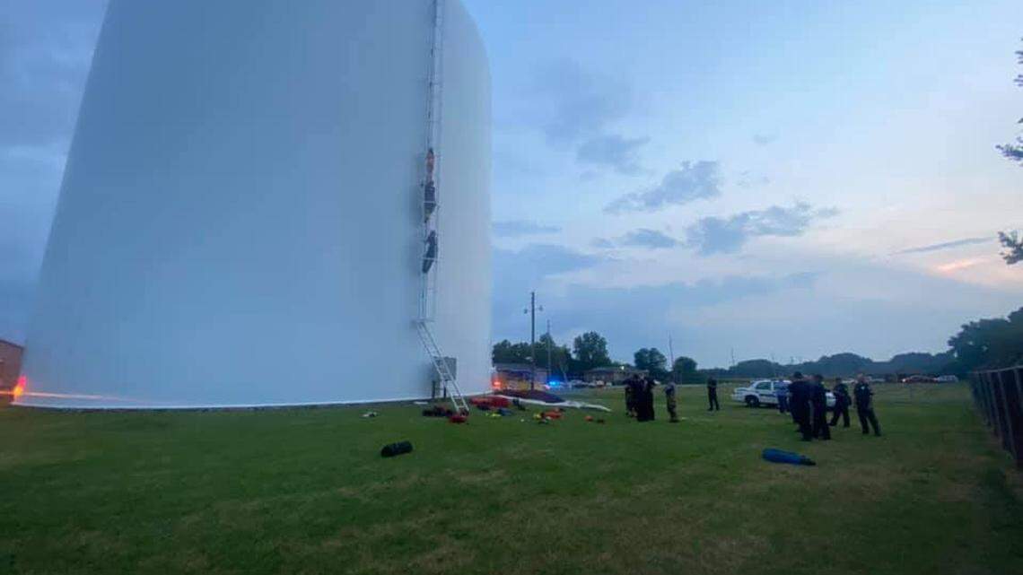 An Alabama woman had to be rescued from a 350,000-gallon water tank after climbing inside for a swim Thursday, authorities said.