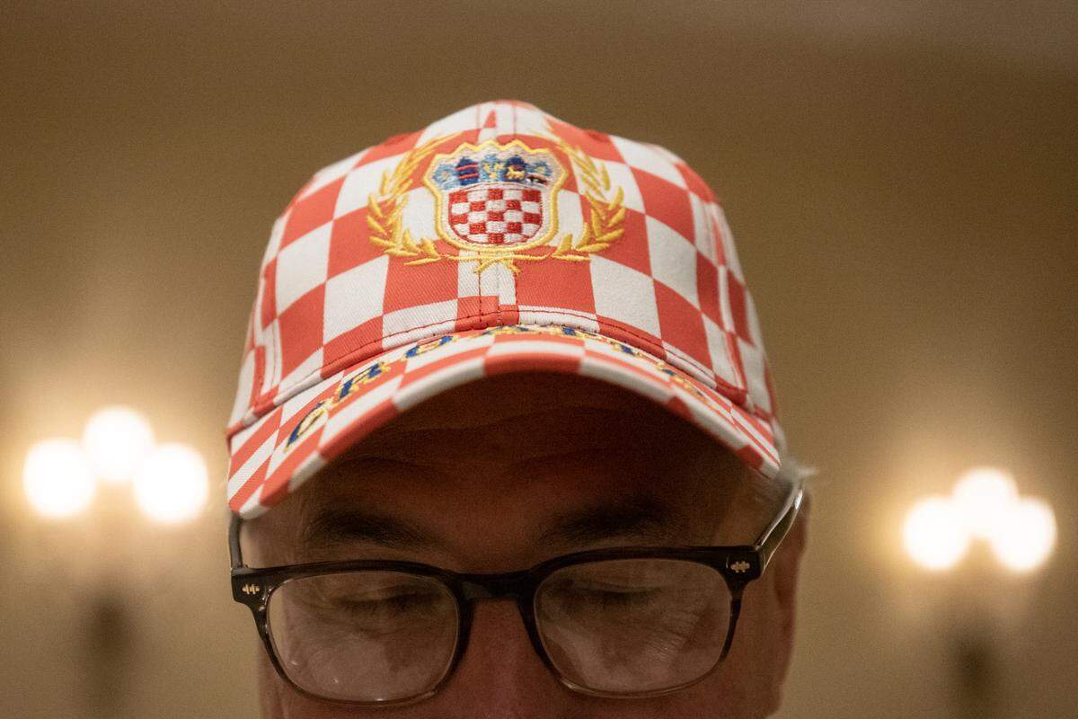 John Rosetti, a Croatian-American from Bay St. Louis, wears a Croatia hat while waiting for Croatian President Zoran Milanović to arrive at the Croatian American Cultural Center in Biloxi, Miss. on Friday, Sept. 22, 2023.